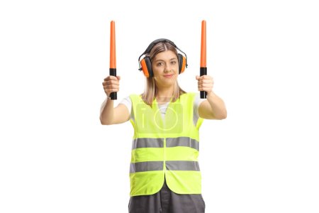 Female aircraft marshaller with wands isolated on white background