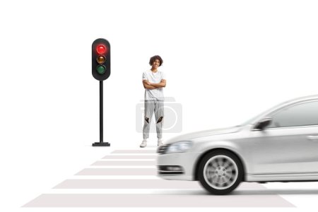 Photo for Young afro american man with dreadlocks standing and waiting at traffic lights isolated on white background - Royalty Free Image