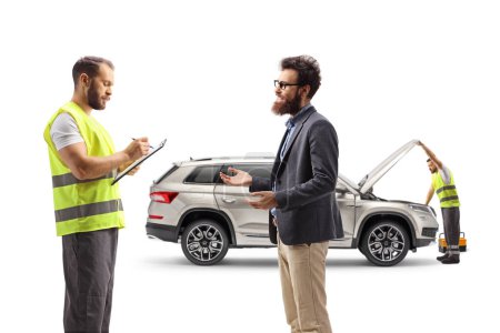 Photo for Bearded man discussing a car problem with a road assistance agent isolated on white background - Royalty Free Image