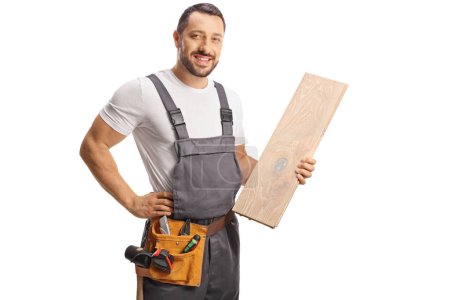 Photo for Carpenter holding a wooden floor beam isolated on white background - Royalty Free Image