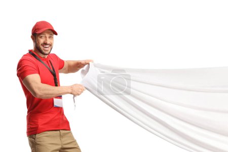 Foto de Vendedor tirando de un gran paño blanco aislado sobre fondo blanco - Imagen libre de derechos