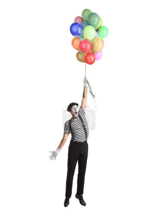 Photo for Mime flying and holding a bunch of balloons isolated on white background - Royalty Free Image