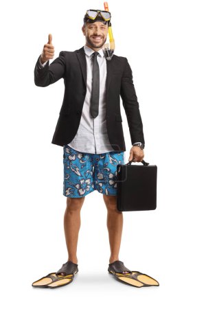 Photo for Businessman in a swimsuit with snorkelling fins and mask holding a briefcase and showing thumbs up isolated on white background - Royalty Free Image