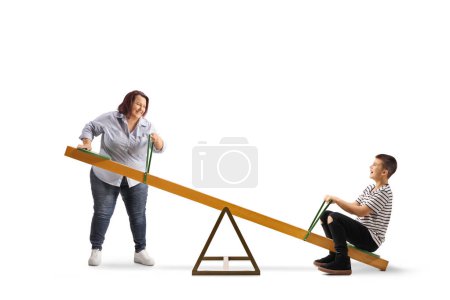 Photo for Mother playing with son on a seesaw isolated on white background - Royalty Free Image