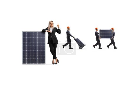 Foto de Businesswoman and factory workers with photovoltaic panels isolated on white background - Imagen libre de derechos