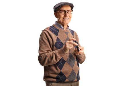 Foto de Elderly man poking finger with a medical device and smiling isolated on white background - Imagen libre de derechos