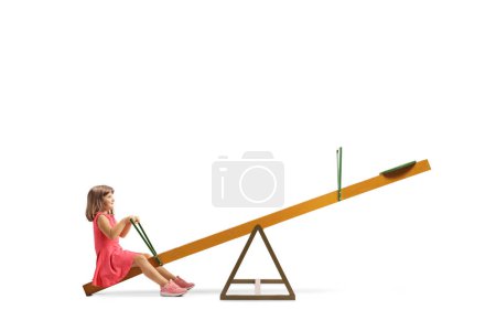 Photo for Little girl sitting on a seesaw alone isolated on white background - Royalty Free Image