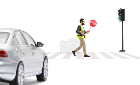 Photo for Full length shot of a man carrying books and a stop sign on a street in front of a car isolated on white background - Royalty Free Image