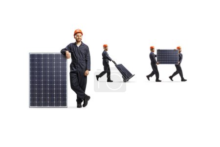 Photo for Workers in suits transporting solar panels with a hand truck  isolated on white background - Royalty Free Image