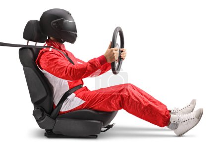Photo for Racer with a helmet sitting in a car wheel and holding a steering wheel isolated on white background - Royalty Free Image