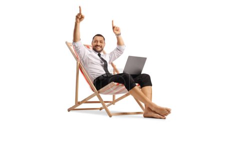 Photo for Businessman smiling and enjoying on a beach chair with a laptop computer isolated on white background - Royalty Free Image