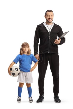 Téléchargez les photos : Entraîneur de football et une fille avec un ballon posant isolé sur fond blanc - en image libre de droit