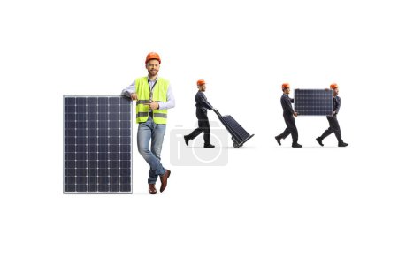 Photo for Engineer pointing and factory workers carrying photovoltaic panels isolated on white background - Royalty Free Image