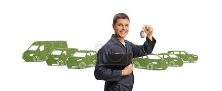 Photo for Auto mechanic holding a clipboard and keys oin front of green electric vehicles isolated on white background - Royalty Free Image