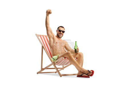 Photo for Man at a beach chair holding a bottle of beer and gesturing happiness isolated on white background - Royalty Free Image