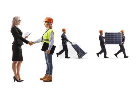 Photo for Female engineer shaking hands with a businesswoman and workers carrying photovoltaic cells isolated on white background - Royalty Free Image