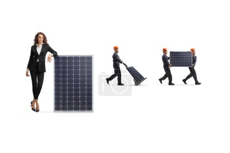 Photo for Businesswoman leaning on a panel and factory workers carrying photovoltaics isolated on white background - Royalty Free Image