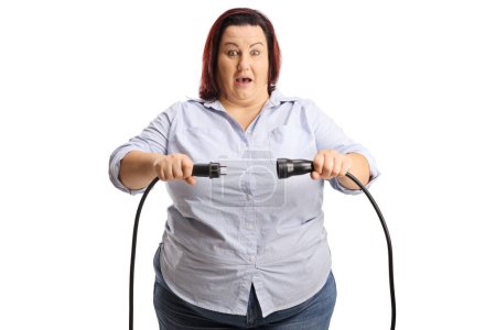 Photo for Shocked woman unplugging cables isolated on white background - Royalty Free Image