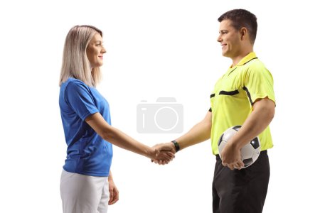 Photo for Profile shot of a football referee shaking hand with a female player isolated on white background - Royalty Free Image