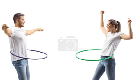 Photo for Profile shot of a man and woman spinning a hula hoops isolated on white background - Royalty Free Image