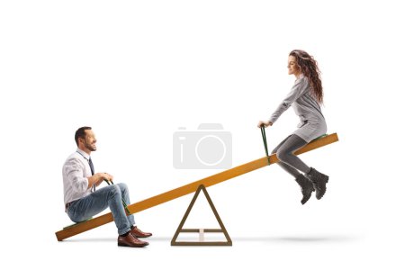 Photo for Young man and woman playing on a seesaw isolated on white background - Royalty Free Image