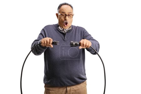 Photo for Scared mature man unplugging cables isolated on white background - Royalty Free Image