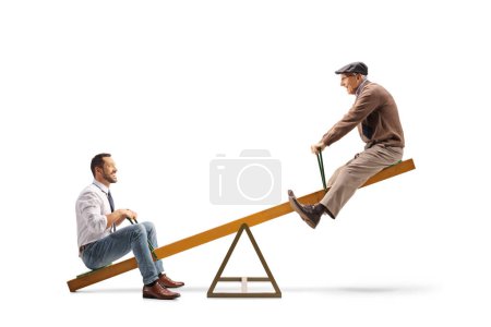 Photo for Smiling man and an elderly man playing on a seesaw isolated on white background - Royalty Free Image