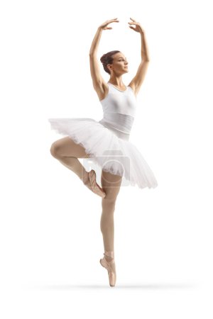 Foto de Foto de perfil completo de una bailarina de ballet en un vestido blanco bailando con los brazos arriba aislados sobre fondo blanco - Imagen libre de derechos