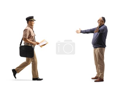Photo for Mailman delivering a letter to a happy mature man isolated on white background - Royalty Free Image