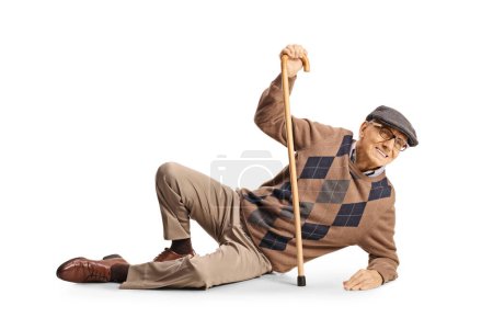 Foto de Anciano con un bastón cayendo en el suelo aislado sobre fondo blanco - Imagen libre de derechos