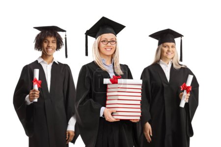 Foto de Grupo de graduados con libros y diplomas aislados sobre fondo blanco - Imagen libre de derechos