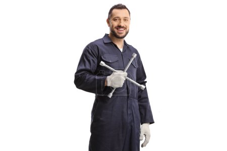 Photo for Auto mechanic holding a lug wrench isolated on white background - Royalty Free Image