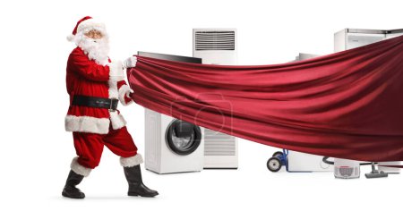 Photo for Santa Claus pulling a red curtain in front of home appliances isolated on white background - Royalty Free Image