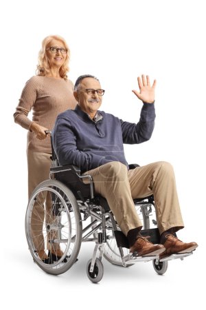 Photo for Woman and a man sitting in a wheelchair and waving isolated on white background - Royalty Free Image