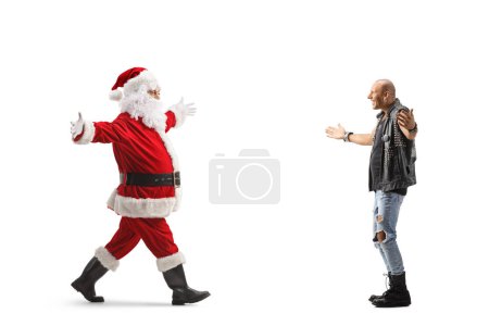Foto de Foto de perfil completo de un punk esperando a Santa Claus con los brazos bien abiertos aislados sobre fondo blanco - Imagen libre de derechos