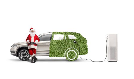 Photo for Santa claus leaning on a hybrid car at a charging station isolated on white background - Royalty Free Image