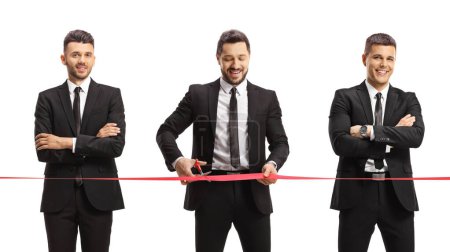 Photo for Businessmen cutting a red ribbon tape at an event opening isolated on white background - Royalty Free Image