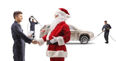 Photo for Santa claus and worker shaking hands in front of a SUV at the car wash isolated on white background - Royalty Free Image