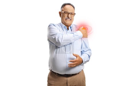 Photo for Mature man in a shirt with pain in shoulder holding a red inflamed spot isolated on white background - Royalty Free Image