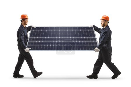 Foto de Trabajadores de la fábrica llevando un fotovoltaico aislado sobre fondo blanco - Imagen libre de derechos