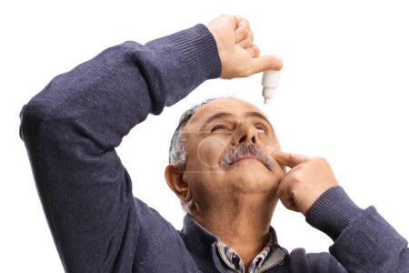 Photo for Mature man applying eye drops, health care concept - Royalty Free Image