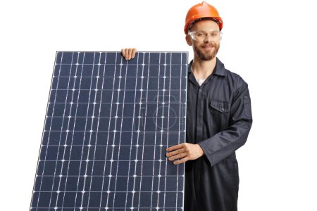 Foto de Trabajador con casco y gafas y de pie detrás de un fotovoltaico aislado sobre fondo blanco - Imagen libre de derechos