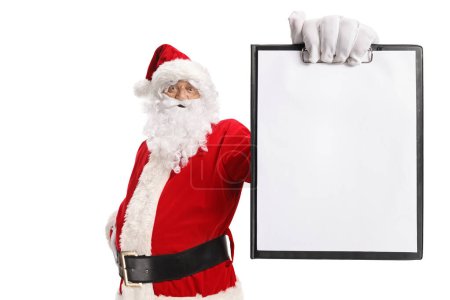 Photo for Santa claus holding a blank paper on a clipboard isolated on white background - Royalty Free Image