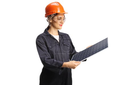Photo for Female factory worker holding a solar panel isolated on white background - Royalty Free Image