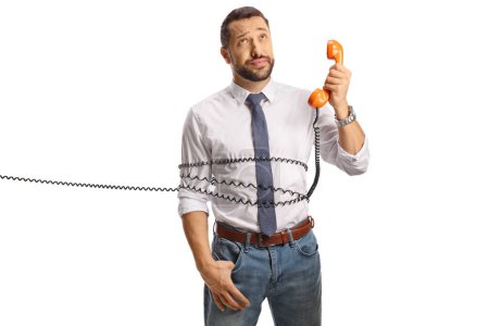 Photo for Man tied with a rotary phone cable isolated on white background - Royalty Free Image