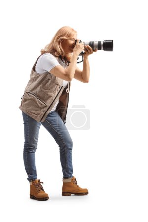 Photo for Full length shot of a female photographer taking a photo isolated on white background - Royalty Free Image