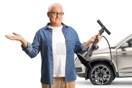 Photo for Driver with a SUV and flat tire holding a manual tire pump isolated on white background - Royalty Free Image
