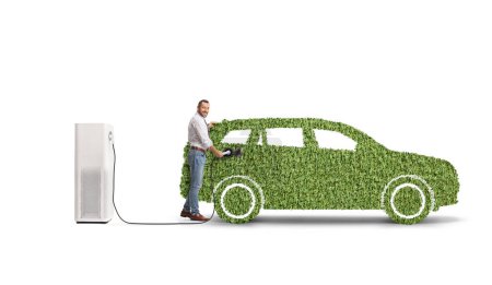 Photo for Man plugging in green electric vehicle charger isolated on white background - Royalty Free Image