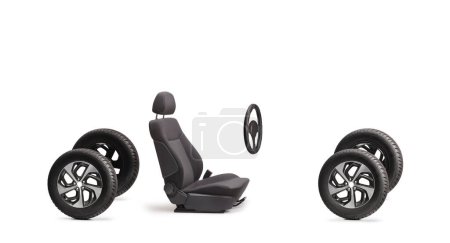 Photo for Four vehicle tires, car seat and a steering wheel isolated on white background - Royalty Free Image