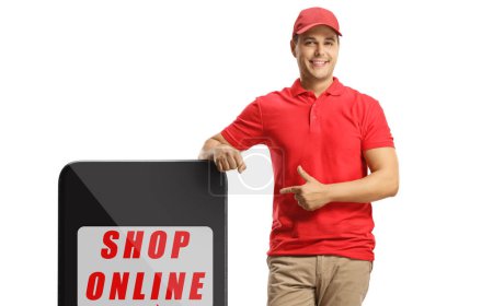 Photo for Delivery guy pointing at online shopping sign isolated on white background - Royalty Free Image